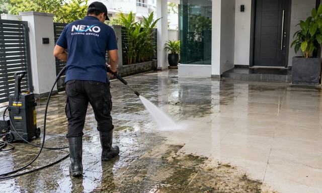 Nexo team pressure washing an outdoor driveway